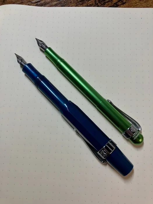 A posted green Kaweco Liliput next to a posted blue Kaweco Sport.